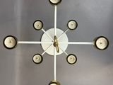 a clock that has candles in the middle of it