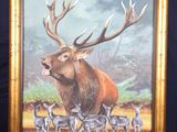 painting of a deer with antlers and a herd of deer on a easel