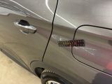 a car with a sticker on the side of it ' s door