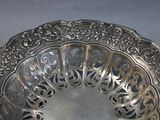 a silver plate with a decorative design on it