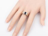 an image of a woman ' s hand with a ring on it