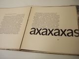 an open book with a picture of the word ajaxxas on it