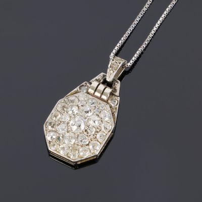 a diamond set pendant on a chain
