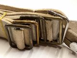 a belt that has four metal buckles on it