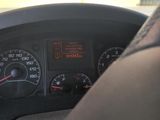 a close up of a car dashboard with a speedometer and gauges