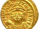 une pièce d'or à l'effigie d'un homme portant une coiffe