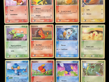 a lot of pokemon cards that are on the table
