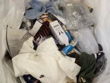 a bag full of clothes and other items in it
