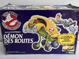 a box that has a yellow toy car in it