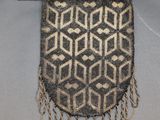 a black and white bag with a pattern on it