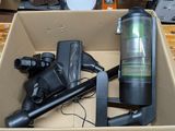 a box that has a vacuum and other items in it