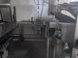 a black and white photo of a kitchen with a lot of counter space
