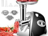 an image of a meat grinder with meat and vegetables on it