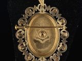 an image of a gold pendant with a masonic symbol on it