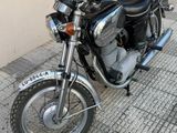 a motorcycle that is parked on the side of the street