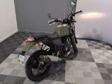 a motorcycle that is sitting on a checkered floor