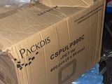 a cardboard box sitting on top of a pile of trash