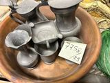 a bowl with a lot of metal items in it