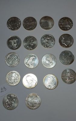 a lot of coins that are sitting on a table