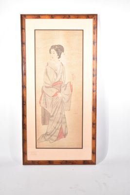 une vieille photo encadrée représentant une femme vêtue d'un kimono