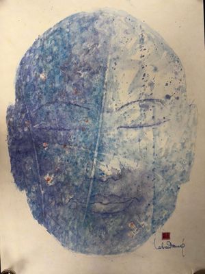 un dessin représentant un visage sur une feuille de papier