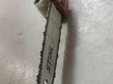 a chainsaw sitting on the floor in a room