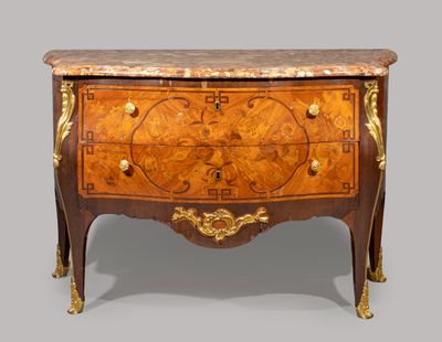 an antique chest of drawers with a marble top and gold accents