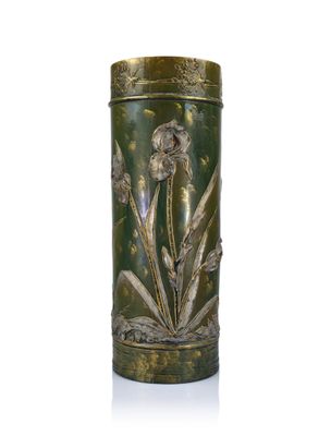 an image of a green vase with flowers on it on a white surface