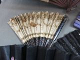a fan that is sitting on a table next to other items