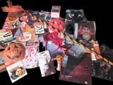 a pile of halloween cards and decorations on a table