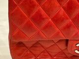 a red purse that is sitting on a table