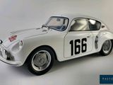 a white car with a number on the side of it