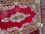 many rugs laid out on the floor on the floor