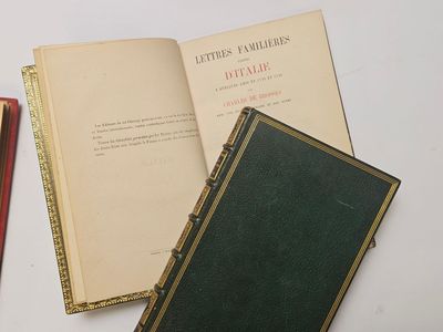 three books sitting on a table next to each other