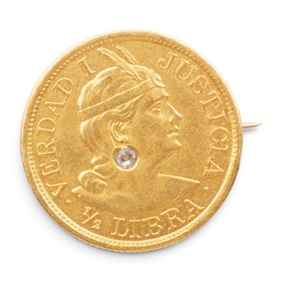 une image représentant une pièce d'or avec un diamant au centre
