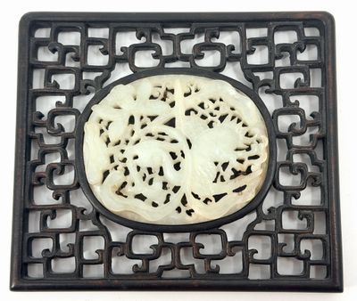 a black and white picture of a decorative object on a white surface