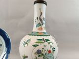 two vases sitting next to each other on a table