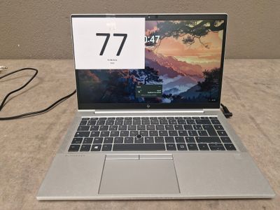 a laptop computer that is sitting on a table