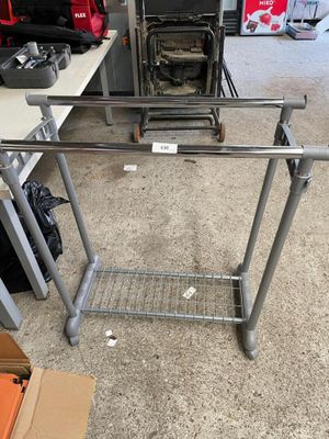an image of a metal table with a shelf on top of it