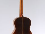 a close up of an acoustic guitar on a white background