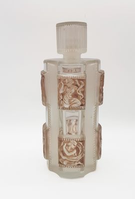 a clear glass bottle with a design on it