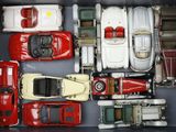 a lot of toy cars in a box on the table
