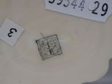 a picture of a white vase with numbers on it