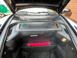 a car with its trunk open and the interior of it