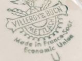 a close up of a plate with a logo on it