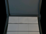 a black case with a white square pattern inside of it