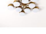 un ensemble de six appliques en laiton et en verre blanc sur fond blanc