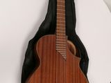 a guitar that is sitting on a white table