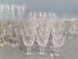 a lot of wine glasses sitting on a table