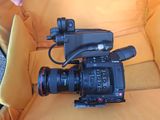a camera that is sitting on a yellow couch